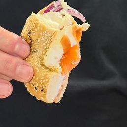 Sesame bagel with lox and cream cheese. Sesame bagel with lox and cream cheese.
