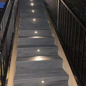 Denver Deck Builders - New staircase of 19 stairs with lights and wrought iron railings - Decks & Railing Near Me