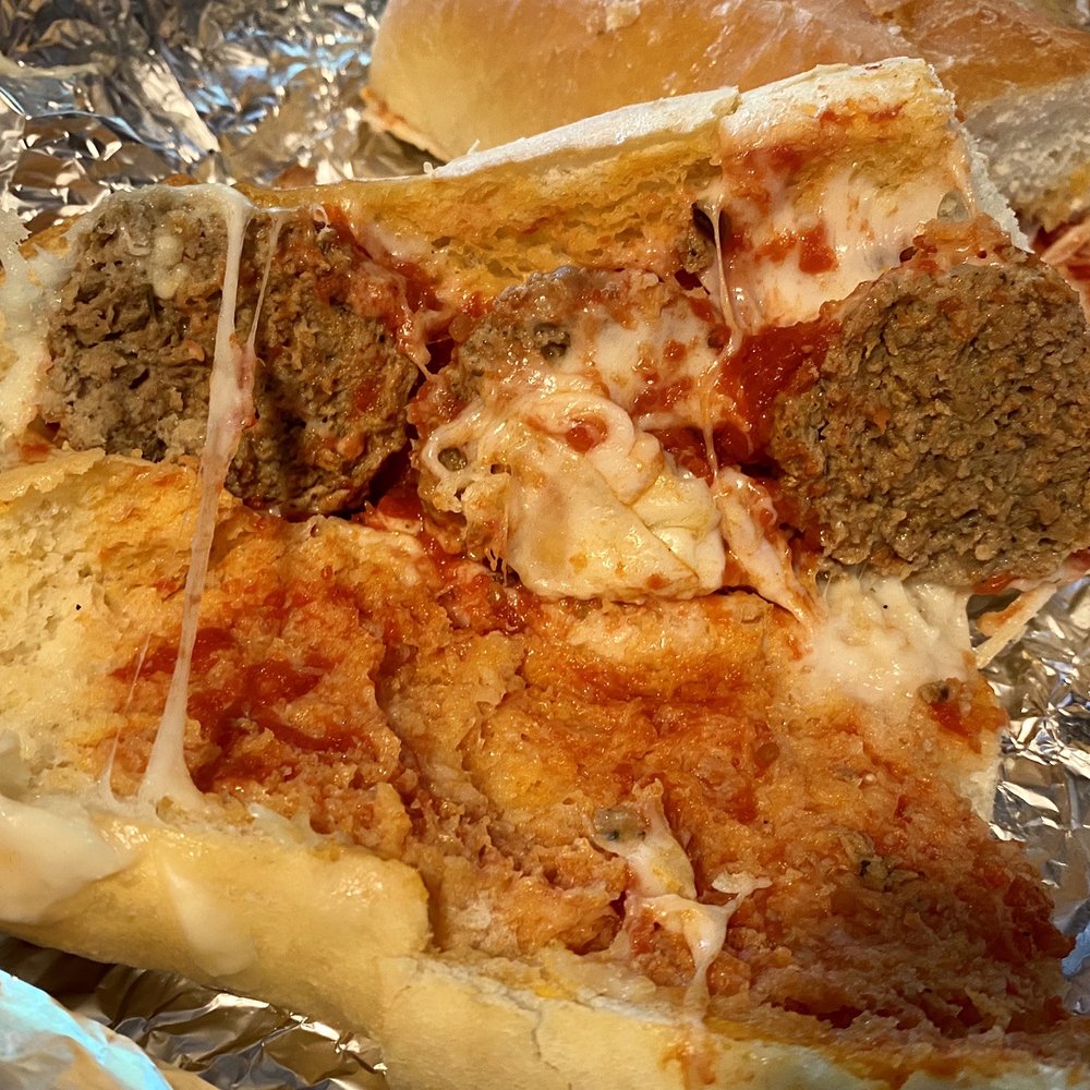 Capri Pizza - Capri Pizza's "large" meatball grinder. Half a footlong shown with only 1 and 1/2 meatballs. - Pizza Near Me - Holyoke, Massachusetts Capri Pizza - Capri Pizza's "large" meatball grinder. Half a footlong shown with only 1 and 1/2 meatballs. - Pizza Near Me - Holyoke, Massachusetts