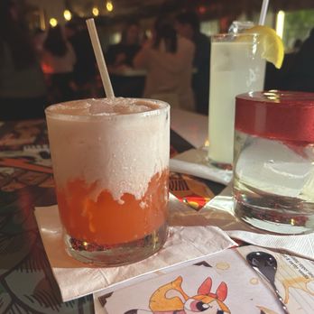 55 South - Blossom Drink to the left and night in Cancun (clear drink with hibiscus foam) - Lounges Near Me - San Jose, California