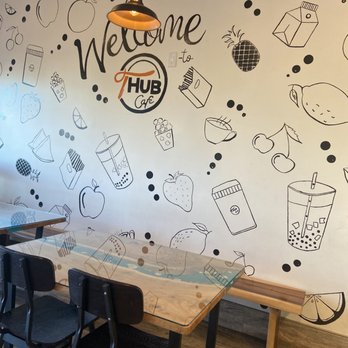 T Hub Cafe - One side of the wall, with tables and seating. - Bubble Tea Near Me - Mountain House, California