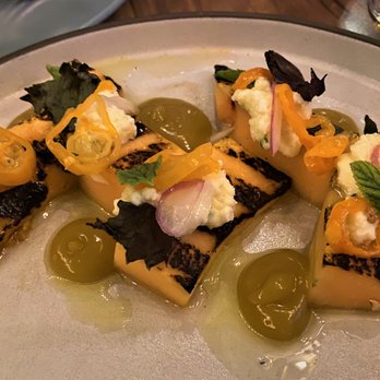 Emmer & Rye - grilled cantaloupe with ricotta and habanada (a heatless habanero) perched on toasted bran amazake - Tapas/Small Plates Near Me - Austin, Texas