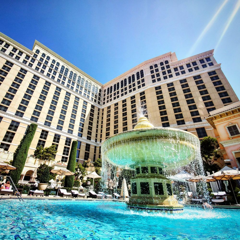 Bellagio Pool - View of the fountain and hotel from the corner of the pool. - Swimming Pools Near Me - Las Vegas, Nevada Bellagio Pool - View of the fountain and hotel from the corner of the pool. - Swimming Pools Near Me - Las Vegas, Nevada