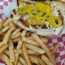 Reno & Woody's - Grinder- Grazianos sausage, mozzarella, banana peppers on a hoagie served with fries