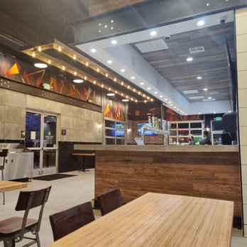 Fire Wings - Nice interior with a few long tables. - Chicken Shop Near Me - Irvine, California Fire Wings - Nice interior with a few long tables. - Chicken Shop Near Me - Irvine, California