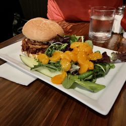 Local Break - "Pulled BBQ Chicken Sandwich" (pulled baked BBQ chicken served on a Kaiser roll, topped with fried onion rings and coleslaw)