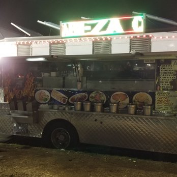 Taco Dollar - Condiments are lined up alongside the truck - Mexican Near Me - Inglewood, California