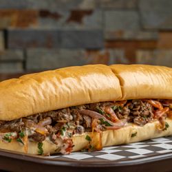 Megawich - The Ultimate Sandwich - The Beef Pitcher:
Marinated thin sliced beef with special spices, tahini dressing, onions, tomatoes and parsley.