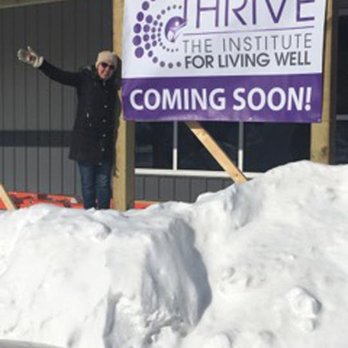 Thriving Thistle Market - a woman standing on a pile of snow - Convenience Stores Near Me - Apple River, Illinois