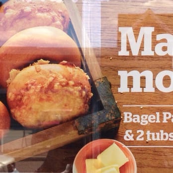 Panera Bread - Advertising on their delicious bagels on the front door...I would suggest the Asiago cheese bagel packed with flavors. - Sandwiches Near Me - Westborough, Massachusetts
