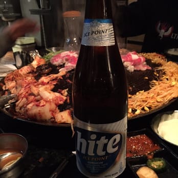 Honey Pig - A large bottle of Hite - Korean Near Me - Duluth, Georgia