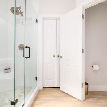Inside Out Construction - a bathroom with a shower and a toilet - General Contractors Near Me