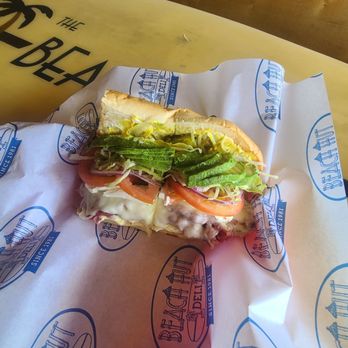 Beach Hut Deli - The Hot Santa Cruz Sandwich.... which includes Pastrami, Avocado, Cream Cheese, bacon, provolone cheese, & more - Delis Near Me - Costa Mesa, California