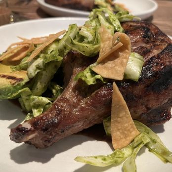 Nopa - We both opted for the pork chop - wood grilled, served with ayocote negro beans, brokaw avocado, and arrowhead cabbage - New American Near Me - San Francisco, California