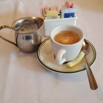 Mio Posto - Very good espresso coffee, with milk on the side, and a sliver of lemon rind. - Italian Near Me - Merrick, New York Mio Posto - Very good espresso coffee, with milk on the side, and a sliver of lemon rind. - Italian Near Me - Merrick, New York
