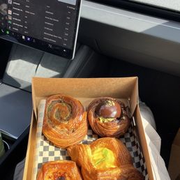 Lamb Rillette Croissant, Dubai Chocolate Danish, Yuzu Mango Danish, Potato Cheddar and Garlic Confit Tile, Banana Miso Milk Chocolate Cookie Lamb Rillette Croissant, Dubai Chocolate Danish, Yuzu Mango Danish, Potato Cheddar and Garlic Confit Tile, Banana Miso Milk Chocolate Cookie