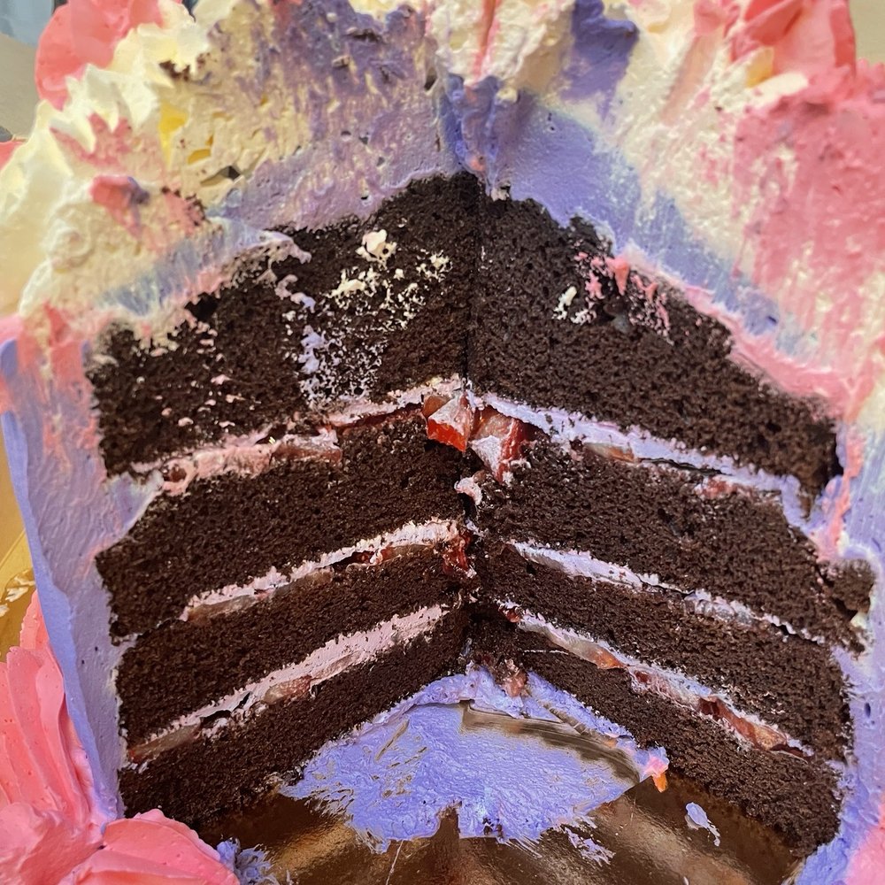 Bagel Cafe & Bakery - Giant cupcake cake. Chocolate with strawberry and vanilla frosting. - Bakeries Near Me - Watsonville, California Bagel Cafe & Bakery - Giant cupcake cake. Chocolate with strawberry and vanilla frosting. - Bakeries Near Me - Watsonville, California