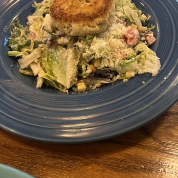 The Kill Devil Grill - Crabcake on a Caesar salad - American Near Me - Kill Devil Hills, North Carolina The Kill Devil Grill - Crabcake on a Caesar salad - American Near Me - Kill Devil Hills, North Carolina