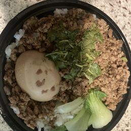 Minced pork over white rice. Could use a little more flavor or sauce.