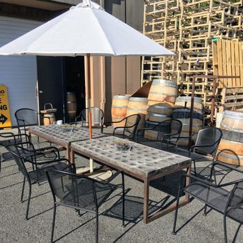 Outside seating area, perfect on our summer sunny days. The table is made from a French champagne rack.
