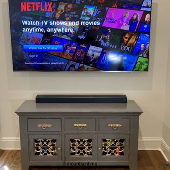 Connected Media Solutions - TV Mounted with Soundbar - Home Theatre Installation Near Me Connected Media Solutions - TV Mounted with Soundbar - Home Theatre Installation Near Me