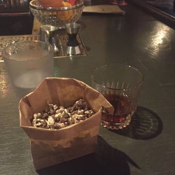 State Park - Chocolate snacks goodness (brown bag) and green walnut (cocktail) - New American Near Me - Cambridge, Massachusetts