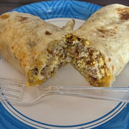 Giant Breakfast burrito with egg, sausage, bacon and cheese. Unbelievably delicious! Giant Breakfast burrito with egg, sausage, bacon and cheese. Unbelievably delicious!