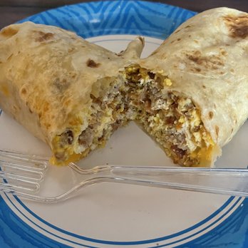 El Coyote Cojo - Giant Breakfast burrito with egg, sausage, bacon and cheese. Unbelievably delicious! - Tacos Near Me - Arlington, Texas El Coyote Cojo - Giant Breakfast burrito with egg, sausage, bacon and cheese. Unbelievably delicious! - Tacos Near Me - Arlington, Texas