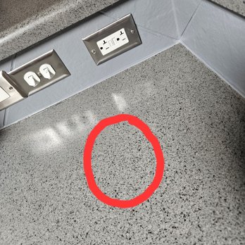 Miracle Method Surface Refinishing - Crack in counter, line visible. lines from added molding were sealed properly and aren't visible, this should have been done the same way. - Refinishing Services Near Me - Austin, Texas