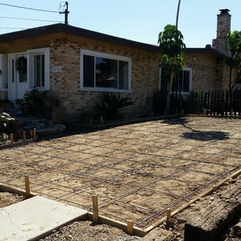Skywest Concrete - a concrete slab being poured in front of a house - General Contractors Near Me Skywest Concrete - a concrete slab being poured in front of a house - General Contractors Near Me