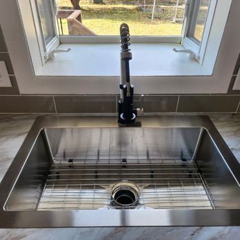 Elevate Your Home - a stainless steel kitchen sink - General Contractors Near Me