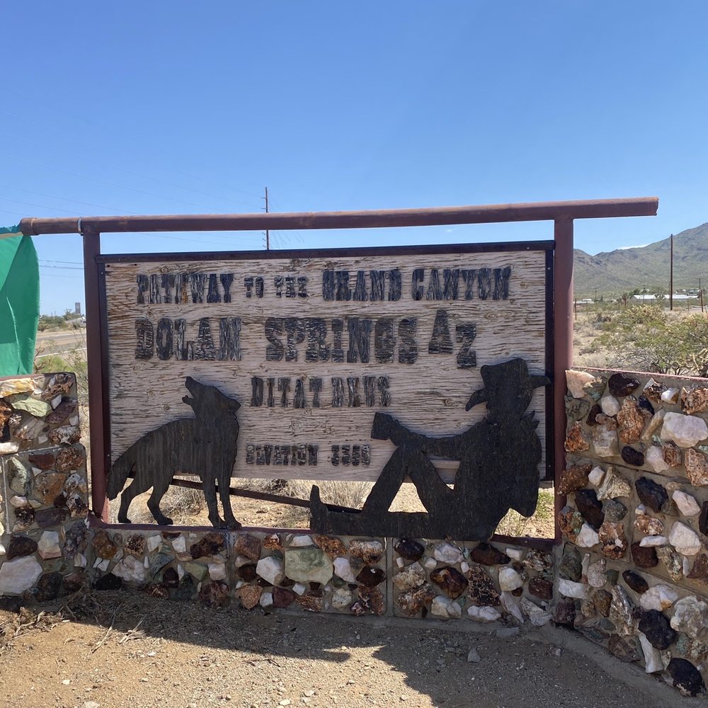 Dolan Station - a horse drawn carriage in front of a sign - Convenience Stores Near Me - Dolan Springs, Arizona