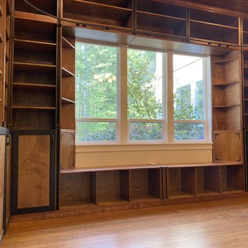 Gustafson Interiors - Window bench nook in custom built library. - General Contractors Near Me Gustafson Interiors - Window bench nook in custom built library. - General Contractors Near Me