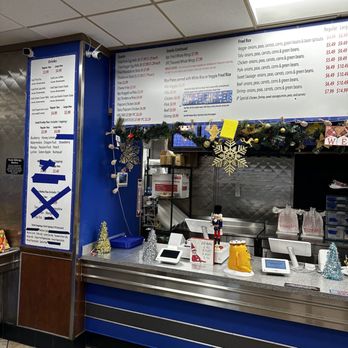 JP Lao Kitchen - a counter with a menu on it - Thai Near Me - Charlotte, North Carolina