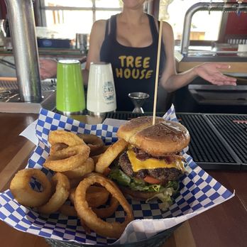 Treehouse - a woman standing behind a basket of food - Sports Bars Near Me - San Antonio, Texas Treehouse - a woman standing behind a basket of food - Sports Bars Near Me - San Antonio, Texas