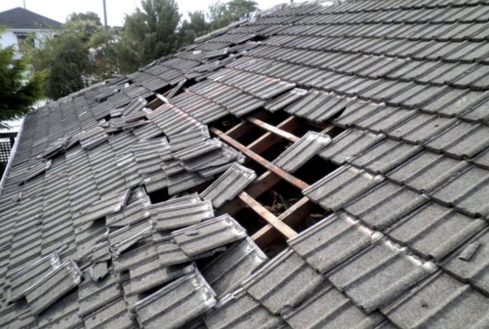 Slide of TM Roofing & Construction Group