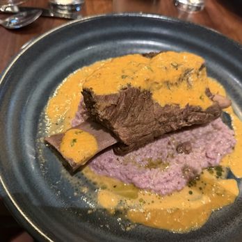 Packard Tavern - Short ribs over purple grits - New American Near Me - Charlotte, North Carolina Packard Tavern - Short ribs over purple grits - New American Near Me - Charlotte, North Carolina