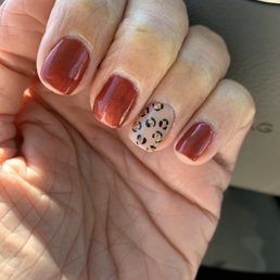 Gel manicure with hand painted leopard print accent Gel manicure with hand painted leopard print accent