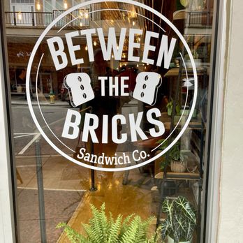 Between The Bricks - Front window sign. - Sandwiches Near Me - Morristown, Tennessee