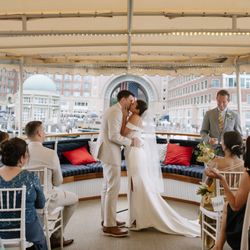 Charles Riverboat - A waterfront wedding ceremony aboard Valiant with Rowes Wharf as the backdrop.
 @byjessherrera