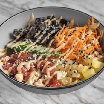 Rozu - a bowl of food on a marble table - Poke Near Me - Miami, Florida Rozu - a bowl of food on a marble table - Poke Near Me - Miami, Florida