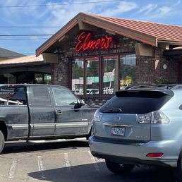 a car parked in front of a restaurant