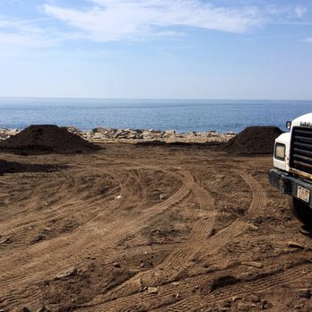 Annisquam Landcare - a truck parked on a beach - Landscaping Near Me - Gloucester, Massachusetts