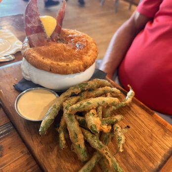 Next Door Beach Bistro - Seafood pot pie serve with tempura green beans - Seafood Near Me - Flagler Beach, Florida Next Door Beach Bistro - Seafood pot pie serve with tempura green beans - Seafood Near Me - Flagler Beach, Florida