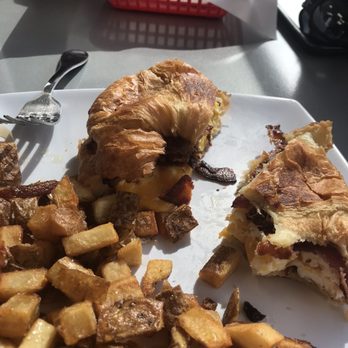 Munch Box - Bacon egg and cheese croissant with home fries... soooo good! Great prices. Meat lovers burrito in the background - Breakfast & Brunch Near Me - Las Vegas, Nevada Munch Box - Bacon egg and cheese croissant with home fries... soooo good! Great prices. Meat lovers burrito in the background - Breakfast & Brunch Near Me - Las Vegas, Nevada