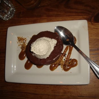 Leon's Full Service - Chocolate-Smoked Pecan Cheesecake - Served on plate drizzled w/rye whiskey caramel and topped w/sea salt whipped cream - Gastropubs Near Me - Decatur, Georgia Leon's Full Service - Chocolate-Smoked Pecan Cheesecake - Served on plate drizzled w/rye whiskey caramel and topped w/sea salt whipped cream - Gastropubs Near Me - Decatur, Georgia