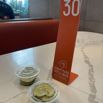 The Stand - American Classics Redefined - Waiting for our order with dill pickles starter. - Burgers Near Me - Long Beach, California