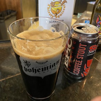 The Thirsty Squirrel - a glass of beer and a can of beer - Bars Near Me - Solitude, Utah