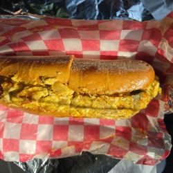 Ronnie's Sandwich Shoppe - Potato, egg and cheddar cheese on a small hero with salt, pepper and ketchup