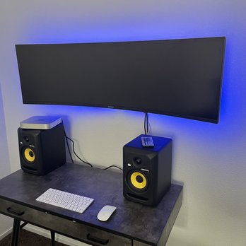 Afro Tech Designs - My home office they mounted my Company screen to make space on my desk and added LED lights which makes it look really cool - TV Mounting Near Me